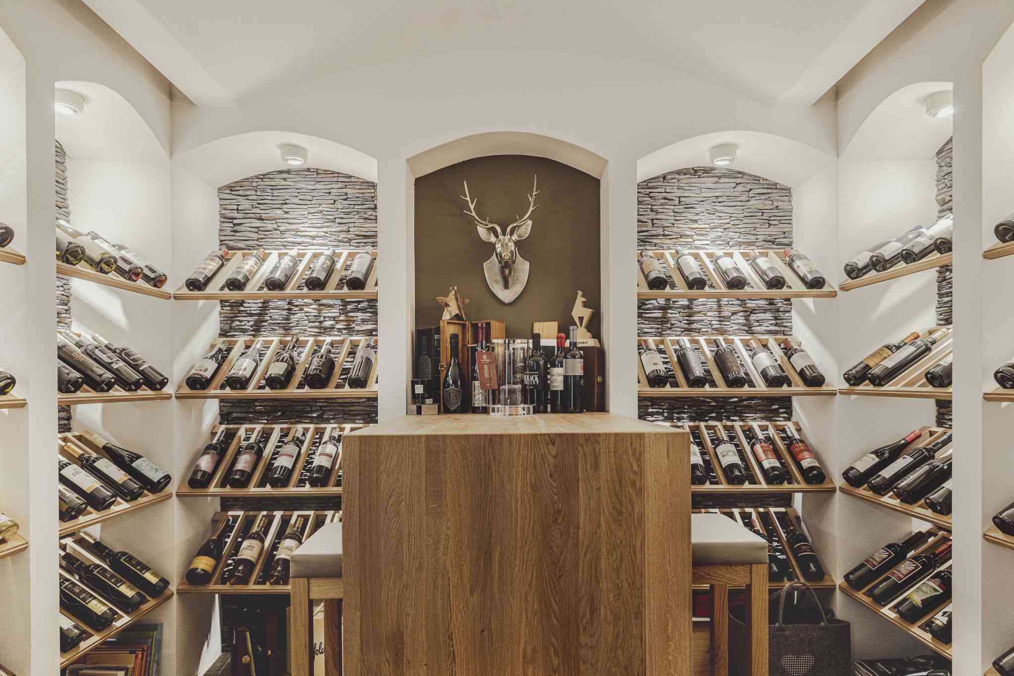 Luxury custom wine cellar installation in Charlotte, NC - climate-controlled wine storage with premium racking and glass enclosures