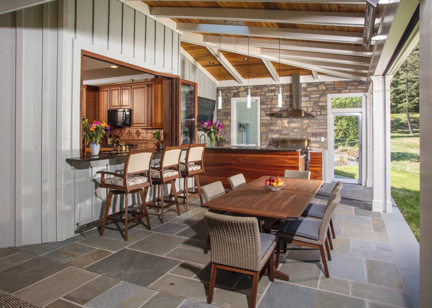 Outdoor wine cellar seamlessly integrated with patio in Lake Norman featuring weather-resistant design